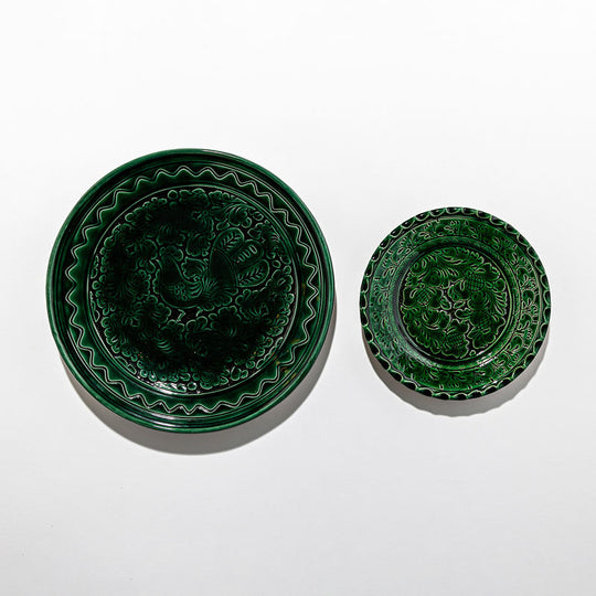 Plates and large green dish