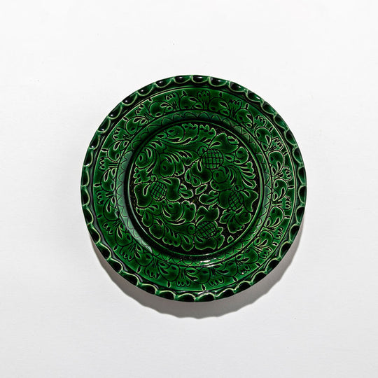 Plates and large green dish