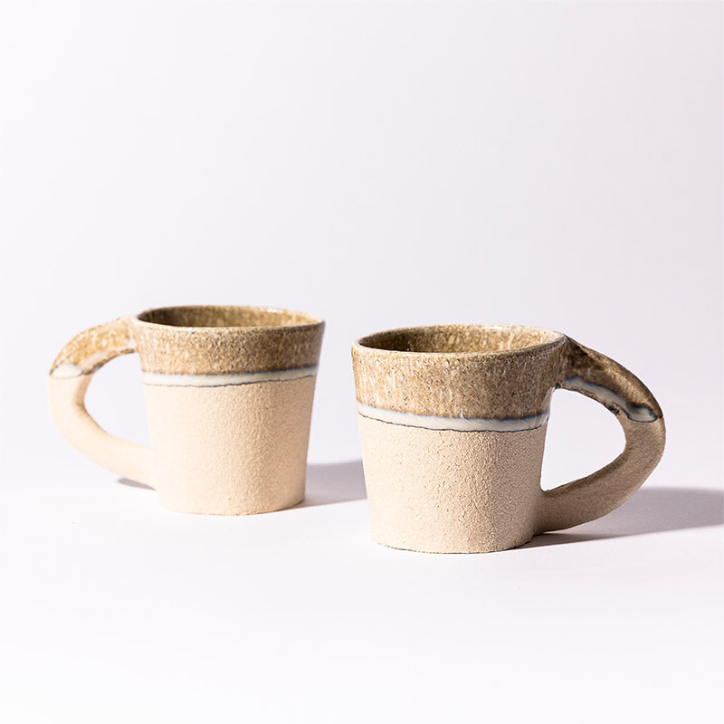 Coffee cup with white handles