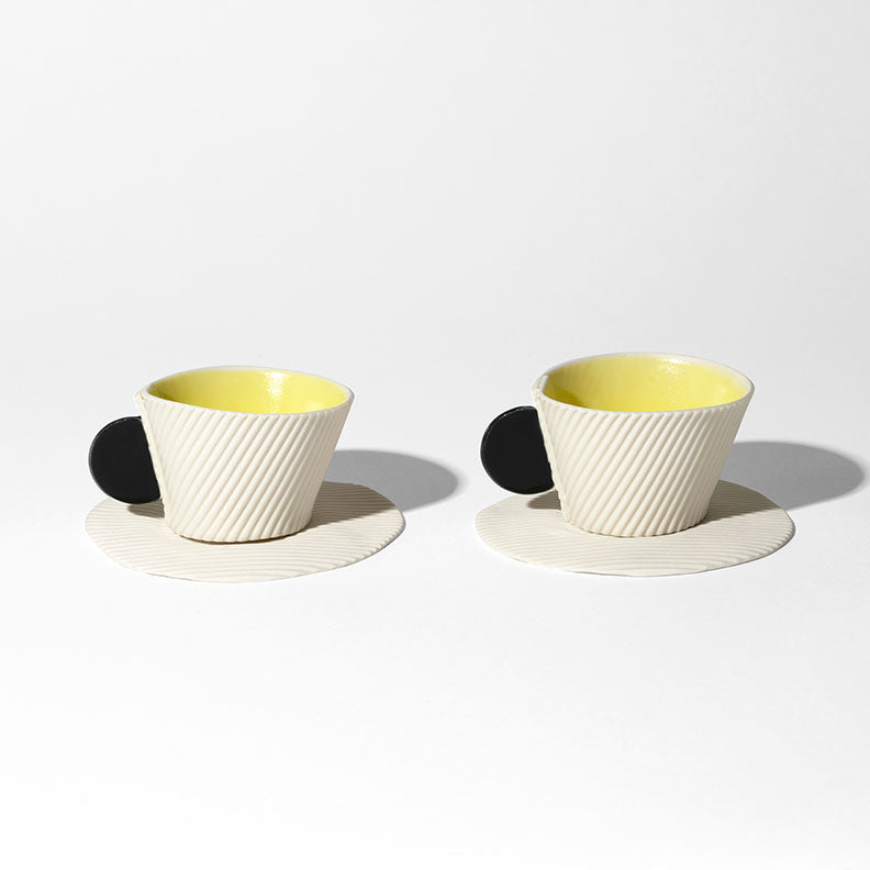 White, black and yellow biscuit porcelain cup