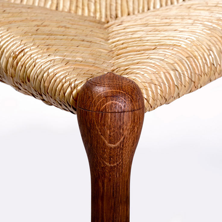 “Tripod” stool in brown oak, straw seating